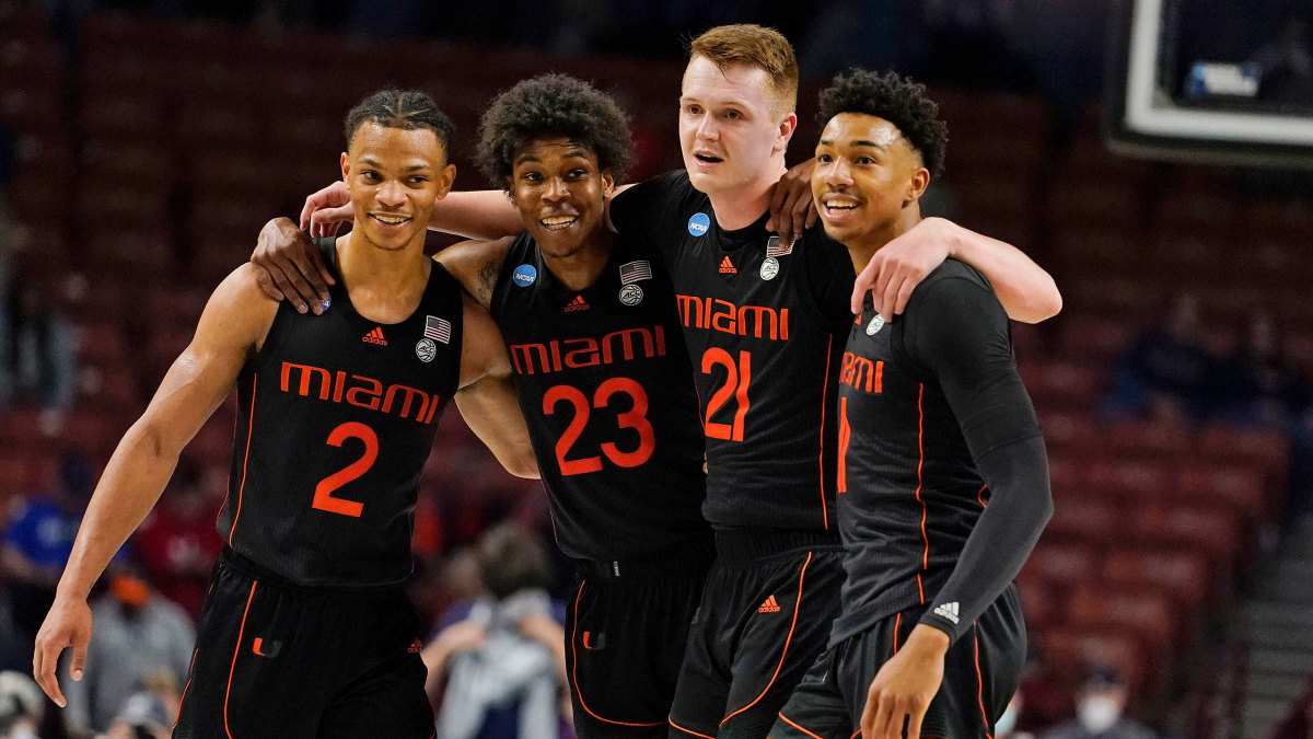 Miami basketball players hug